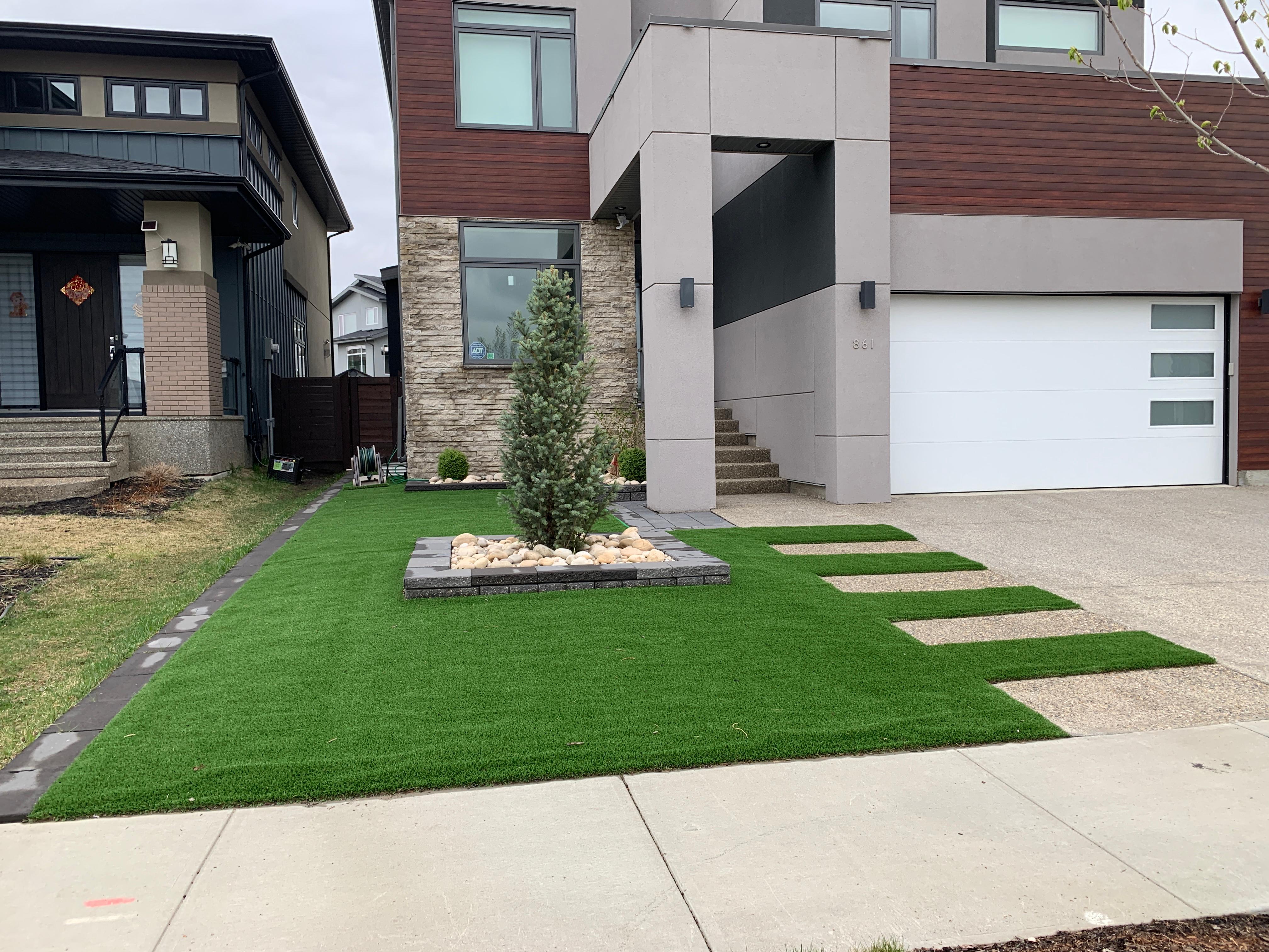 ALA Landscaping completed landscaping project - modern home front yard with turf and stepping stone path